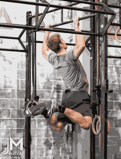 a slow motion butterfly kipping pull-up gif