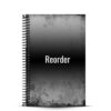 black and grey journal on white background with reorder words on front