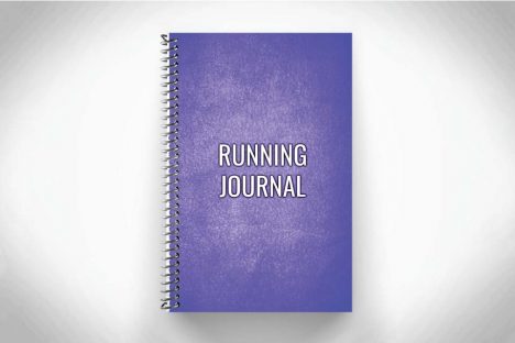 Purple running journal for tracking distance and running workouts on gray background