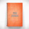 Orange WOD journal for crossfit workouts on gray background