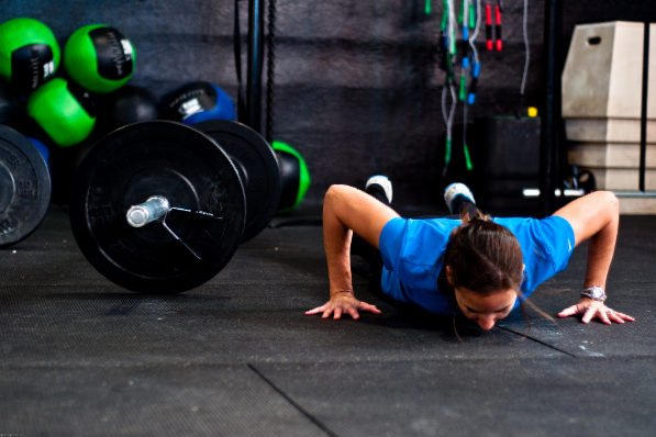 Photo of a girl scaling her workout to match her ability