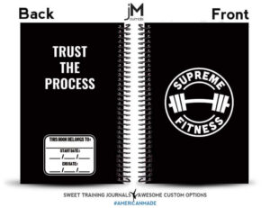 black and white weightlifting journal with supreme fitness logo on the front and trust the process on the back
